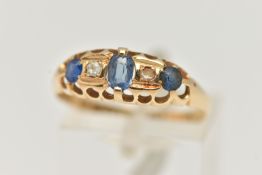 AN EARLY 20TH CENTURY SAPPHIRE AND DIAMOND RING, a principally set oval cut sapphire, set with two