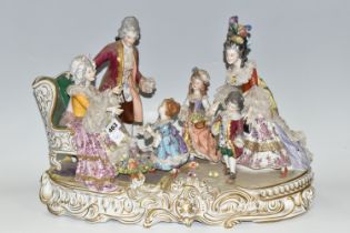 A DRESDEN FIGURE GROUP, an early 20th century German porcelain figure group depicting a joyful