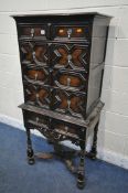 AN EARLY 20TH CENTURY JACOBEAN STYLE CHEST ON STAND, fitted with five drawers with various geometric