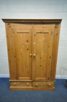 A 20TH CENTURY PINE DOUBLE DOOR WARDROBE, with two drawers, width 145cm x depth 56cm x height