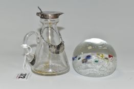 A SMALL SILVER MOUNTED GLASS WHISKY JUG, SILVER LABEL AND A PAPERWEIGHT, comprising whisky jug