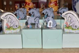 A GROUP OF BOXED DISNEY 'CLASSIC POOH' FIGURINES, comprising five Eeyore 'sitting' figures, five