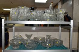 A LARGE QUANTITY OF CUT CRYSTAL AND GLASSWARE, comprising fruit bowls, rose bowls, punch bowl,