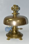 A BRASS DOMED CHURCH ALTAR GONG, circular stepped base raised upon four feet, approximate height