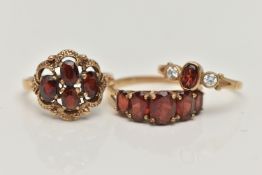 THREE GARNET RINGS, the first a four stone garnet cluster prong set in yellow gold with scalloped