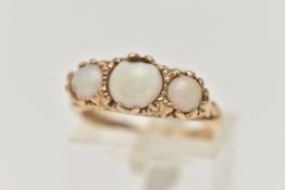 A 9CT GOLD OPAL RING, three round opals, prong set in yellow gold with a scrolled detail gallery,