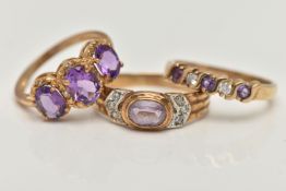 THREE 9CT GOLD AMETHYST RINGS, the first a three stone oval cut amethyst ring with round brilliant