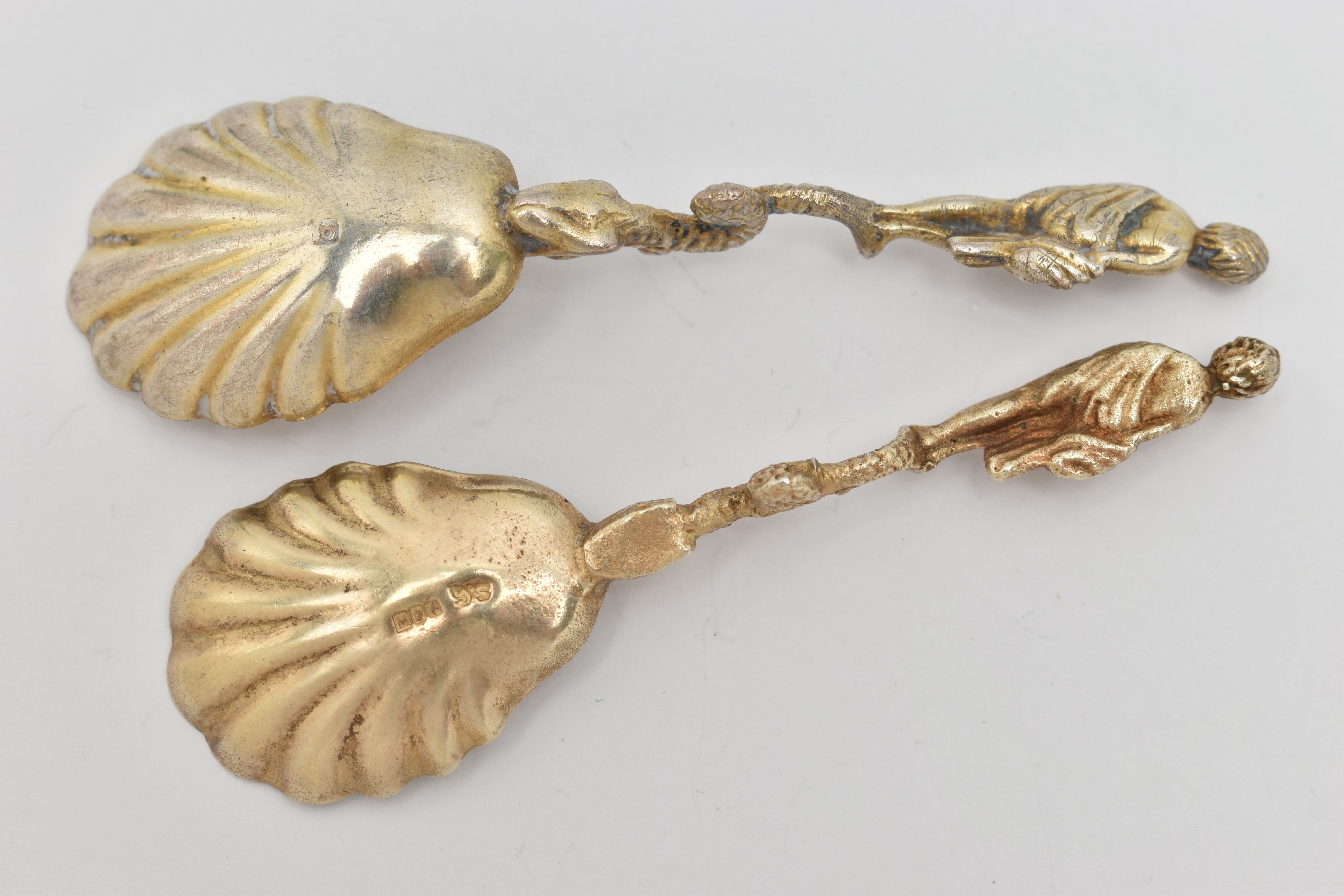 TWO CONDIMENT SPOONS, both with a gilt shell shape bowls, fitted with fish and a robed man to the - Image 2 of 2