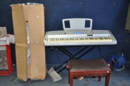 A YAMAHA DGX-300 PORTABLE GRAND ELECTRONIC KEYBOARD with power supply, stand, original box, cover,