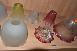 A GROUP OF NINE GLASS ART DECO LAMP SHADES, comprising a pair of acid etched clear to cranberry