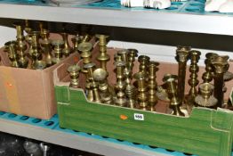 TWO BOXES OF BRASS CANDLESTICKS, thirty four candlesticks including pairs and singles, of