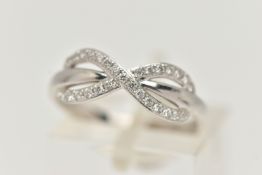 A 9CT GOLD AND DIAMOND RING, white gold infinity design ring, grain set with round brilliant cut