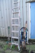 AN ALUMINIUM DOUBLE EXTENSION LADDER with 13 rungs to each 350cm length, two step ladders and a