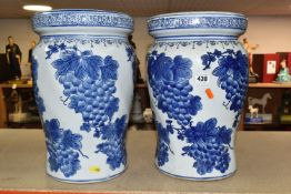 A PAIR OF CHINESE BLUE AND WHITE PORCELAIN GARDEN SEATS, decorated overall with grapes and vines,