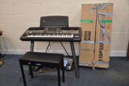 A YAMAHA PSR9000 ELECTRONIC KEYBOARD in box with volume pedal, manuals and disks, Yamaha stand and