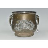 AN ORIENTAL BRONZE PLANTER, decorated with a repoussé Japanese three clawed dragon on two sides