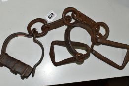 19TH CENTURY WROUGHT IRON SHACKLES, crude decoration to the flat links, lacking lock mechanism and