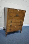 A 20TH CENTURY WALNUT TALLBOY, with double cupboard doors, above three graduated drawers, on