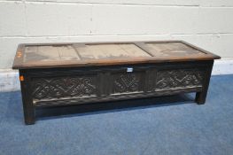 A GEORGIAN AND LATER LOW BLANKET CHEST, with a removable lid and carved panels to all sides, width
