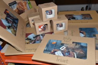 A GROUP OF BOXED NEW AND UNUSED BORDER FINE ARTS 'KITCHY & CO' GLASS CHOPPING BOARDS, TRIVETS AND