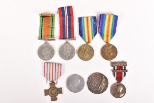 A SELECTION OF WWI AND WWII MEDALS, to include a WWII 1939-45 medal and defence medal, both un-named