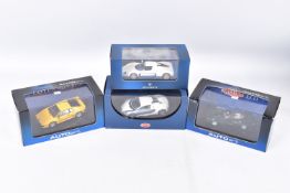 FOUR BOXED DIECAST MODEL VEHICLES, the first is a Maserati MC12 numbered MOC041, Maserati sticker