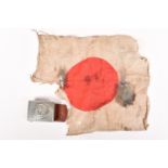 A WWII ERA SMALL JAPANESE FLAG AND A GERMAN BELT BUCKLE, the flag is distressed and the vendor