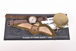 A WWI ERA FLYERS WRIST COMPASS, a pocket compass and a set of RFC cloth wings, the wrist compass