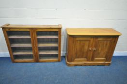 A PINE DOUBLE DOOR CABINET, width 119cm x depth 46cm x height 86cm, along with a pine bookcase,