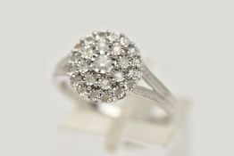 A WHTE METAL DIAMOND CLUSTER RING, circular cluster set with round brilliant and single cut