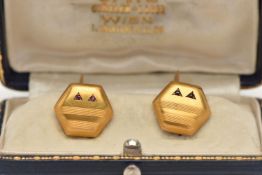A PAIR OF YELLOW METAL GEM SET CUFFLINKS, hexagon form cufflinks, with engine turned pattern, two