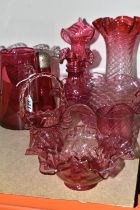 A GROUP OF CRANBERRY GLASS, comprising three frilled edge bowls, a small basket, tumbler (