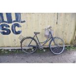 A VINTAGE DUNELT LADIES SHOPPING BIKE with distressed front basket, 22in frame