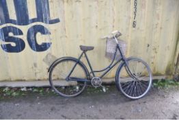 A VINTAGE DUNELT LADIES SHOPPING BIKE with distressed front basket, 22in frame