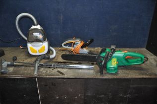 A ZANUSSI CYCLONE CLASSIC VACUUM CLEANER, a Black and Decker electric chainsaw and a Titan