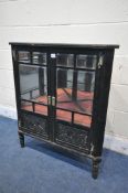 AN EBONISED CORNER CUPBOARD, the double doors with an arrangement of bevelled glass panes and