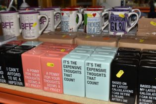 SEVENTY ONE BOXED NOVELTY MUGS AND CERAMIC MONEY BANKS, twelve boxed 'Our Name Is Mud' mugs