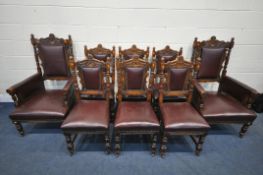 A PAIR OF EARLY 20TH CENTURY OAK FRAMED DEEP ARMCHAIRS, with twin finials, flanking a central carved