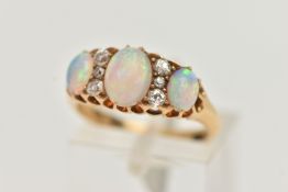 AN EARLY 20TH CENTURY OPAL AND DIAMOND RING, three oval cabochon opals prong set in yellow metal,