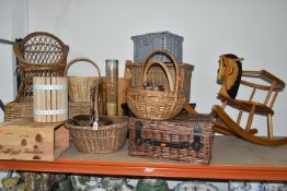 A QUANTITY OF WICKER BASKETS, HAMPERS, CHAIR AND A WOODEN ROCKING HORSE, comprising a child's
