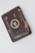 A VICTORIAN TORTOISESHELL AND SILVER INLAID CARD CASE, the front with shield shaped cartouche