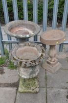 A WEATHERED COMPOSITE CAMPAGNA GARDEN URN measuring diameter 44cm x height 63cm, along with a
