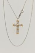 A 'TIFFANY & CO' 'SCHLUMBERGER' DIAMOND CROSS PENDANT, ten round brilliant cut diamonds prong set in