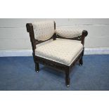 IN THE MANNER OF CHRISTOPHER DRESSER, AN EDWARDIAN WALNUT CORNER CHAIR, with beige and floral