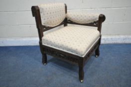 IN THE MANNER OF CHRISTOPHER DRESSER, AN EDWARDIAN WALNUT CORNER CHAIR, with beige and floral