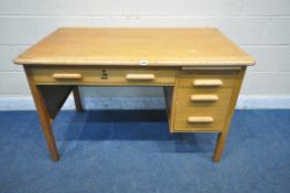 A 20TH CENTURY ABBESS LIGHT OAK DESK, fitted with an arrangement of three drawers and a brushing