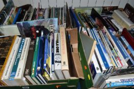 FOUR BOXES OF BOOKS AND MAGAZINES, over one hundred titles in hardback and paperback formats, to