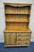 A 19TH CENTURY PINE DRESSER, the top two tier plate rack, on a base with a single cupboard door