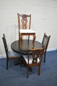 A CIRCULAR MAHOGANY EXTENDING DINING TABLE, with a single fold out leaf, diameter 106cm x height