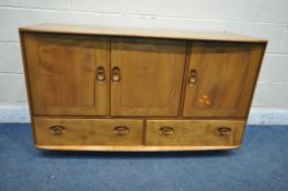 A MID-CENTURY ERCOL ELM WINDSOR ROLLING SIDEBOARD, fitted with three cupboard doors, right hand door